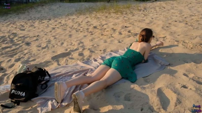 a cutie in a dress sunbathes and shows tits while no one sees